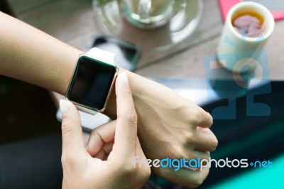 Hand Using Watch On Top View Stock Photo