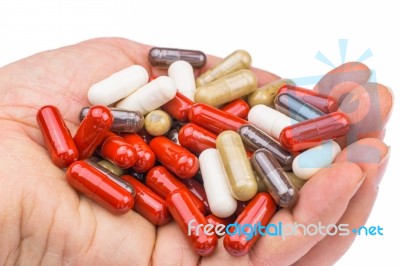 Hand With Medical Capsules Stock Photo