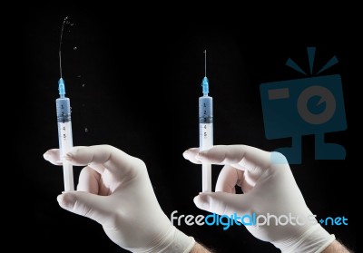 Hand With Syringe Stock Photo