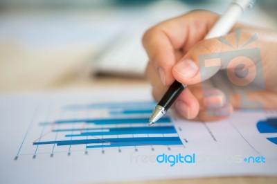 Hand Write On Various Financial Charts On The Table Stock Photo