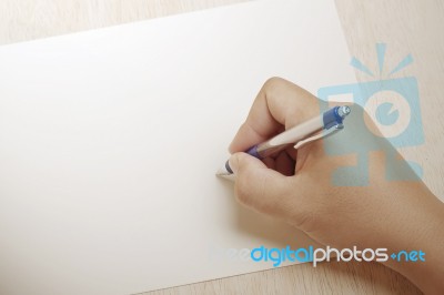 Hand Writing Something On The Paper Sheet Stock Photo