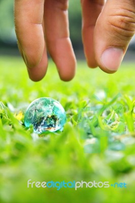 Hands And Earth Stock Photo