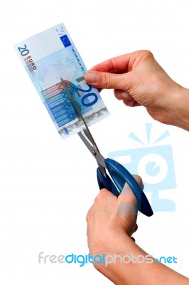 Hands Cutting Banknote Stock Photo