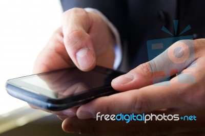 Hand's Detail Of Businessman  Using A Samrtphone Stock Photo