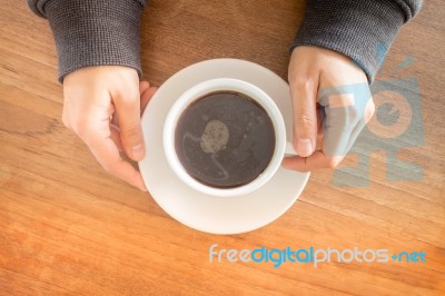 Hands Holding Cup Of Hot Coffee Stock Photo