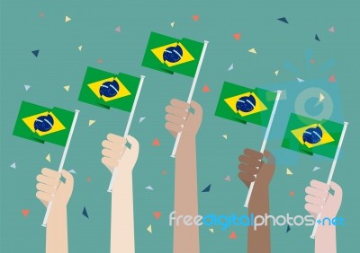 Hands Holding Up Brazil Flags Stock Image