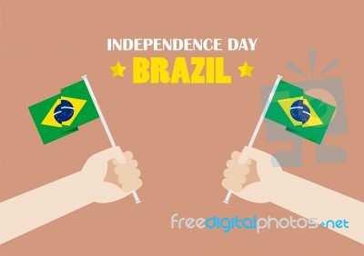 Hands Holding Up Brazil Flags Stock Image