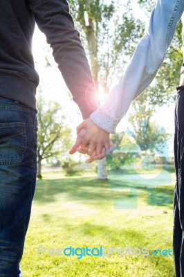 Hands Of A Couple Held Together Stock Photo