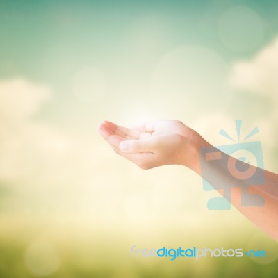 Hands Of Little Girl On Natural Background Stock Photo