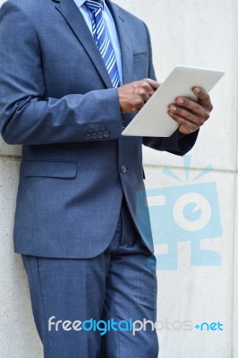 Hands Of The Businessman Using A Tablet Pc Stock Photo