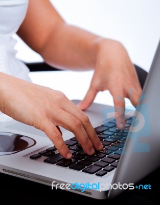 Hands Typing On Laptop Stock Photo