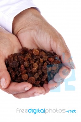 Hands With Raisins Stock Photo