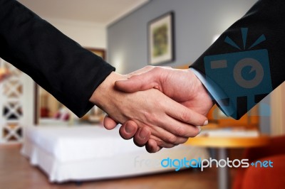 Handshake Between Two Business Partners Stock Photo