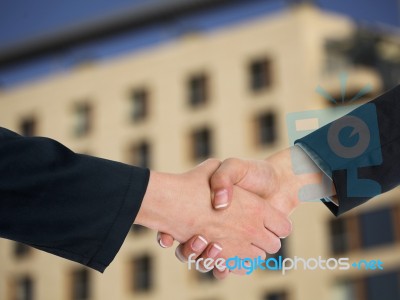 Handshaking Business People Stock Photo