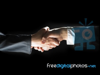 Handshaking Business People Stock Photo