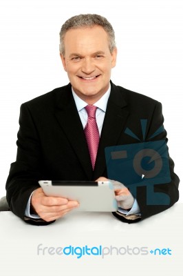 Handsome Aged Business Male Using Tablet Pc Stock Photo