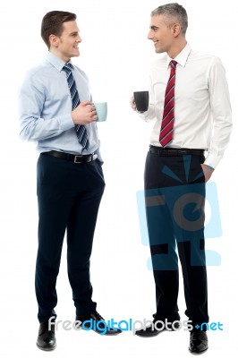 Handsome Business Executives Toasting Coffee Stock Photo