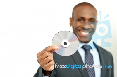 Handsome Businessman Holding A Cd Stock Photo