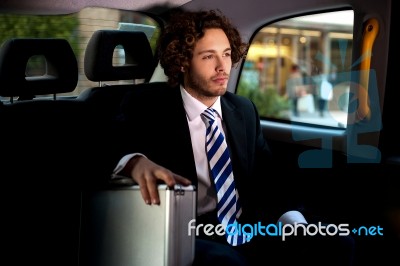 Handsome Businessman Inside Taxi Cab Stock Photo