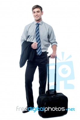 Handsome Businessman Posing With Trolley Bag Stock Photo