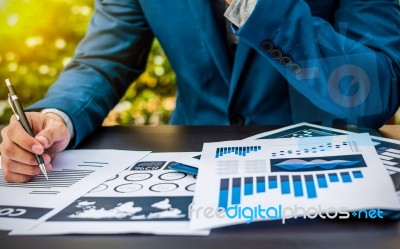 Handsome Businessman Wearing Suit And Using Modern Laptop Outdoo… Stock Photo