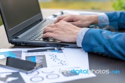 Handsome Businessman Wearing Suit And Using Modern Laptop Outdoo… Stock Photo