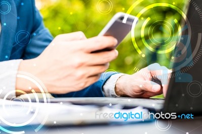 Handsome Businessman Wearing Suit And Using Modern Laptop Outdoo… Stock Photo