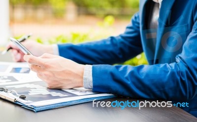 Handsome Businessman Wearing Suit And Using Modern Laptop Outdoo… Stock Photo