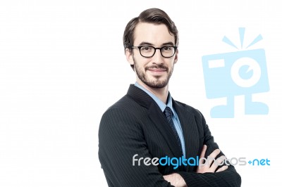 Handsome Businessman With Folded Arms Stock Photo