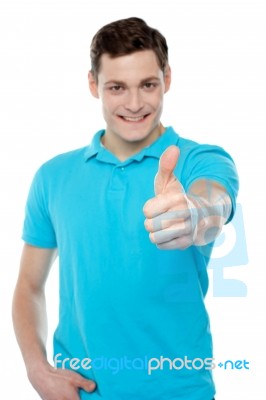 Handsome Casual Smiling Guy Showing Thumbs Up Stock Photo