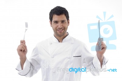 Handsome Chef Holding Knife And Fork In Hands Stock Photo