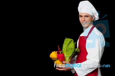 Handsome Chef Holding Vegetables Bowl Stock Photo