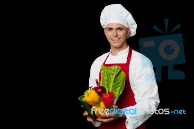 Handsome Chef Holding Vegetables Bowl Stock Photo