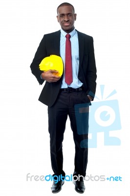 Handsome Engineer Holding Yellow Helmet Stock Photo