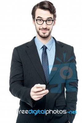 Handsome Entrepreneur Using Mobile Phone Stock Photo