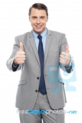 Handsome Executive Showing Double Thumbs Up Stock Photo