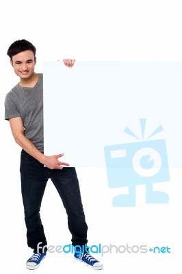 Handsome Guy Holding Blank Ad Board Stock Photo