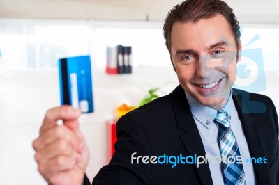 Handsome Male Executive Holding Cash Card Stock Photo