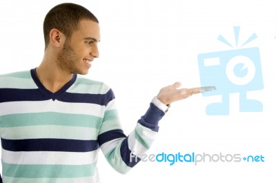 Handsome Male Holding Something With Hand Gesture Stock Photo