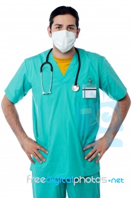 Handsome Male Nurse With Hand On Hips Stock Photo