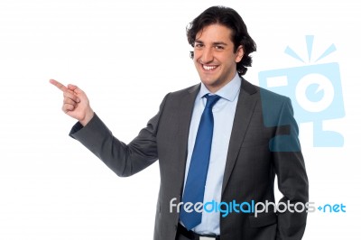 Handsome Male Professional Pointing Away Stock Photo