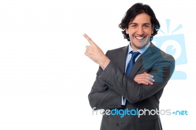 Handsome Male Professional Pointing Away Stock Photo