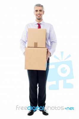 Handsome Male With With Stack Of Boxes Stock Photo