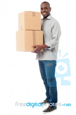 Handsome Male With With Stack Of Boxes Stock Photo