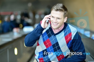 Handsome Man Communicating With Friend Stock Photo