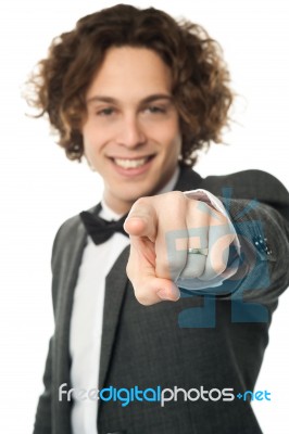 Handsome Man In Bowtie Pointing You Out Stock Photo