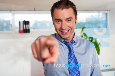 Handsome Man In Formals Pointing At You Stock Photo