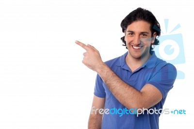 Handsome Man Pointing At Something Stock Photo