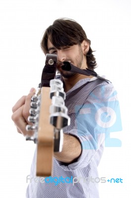 Handsome Man Pointing At You With Guitar Stock Photo