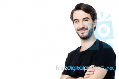 Handsome Man Posing With Folded Arms Stock Photo